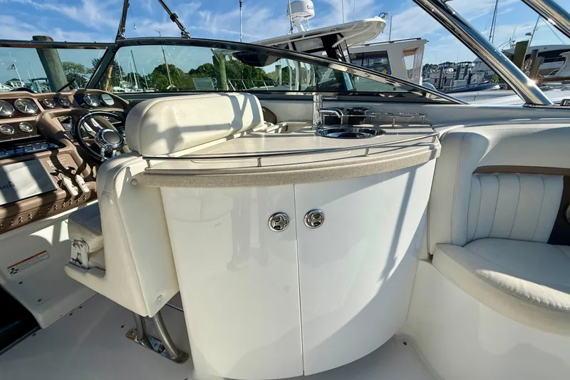 Slide: The Image of Interior of a 2007 Cobalt 323 boat featuring a sleek helm and seating area. - 14