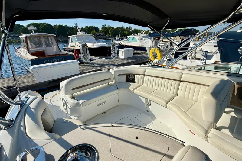 Slide: The Image of 2007 Cobalt 323 boat with spacious seating at a marina dock. - 15