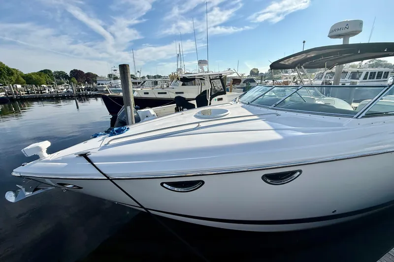 Slide: The Image of 2007 Cobalt 323 boat docked at marina under clear blue sky. - 4