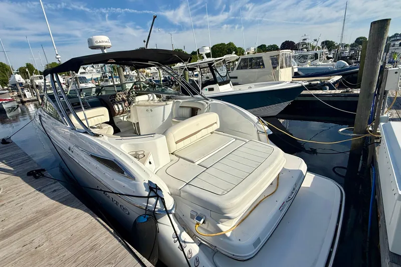 Slide: The Image of 2007 Cobalt 323 boat docked at marina, featuring spacious seating and sleek design. - 6