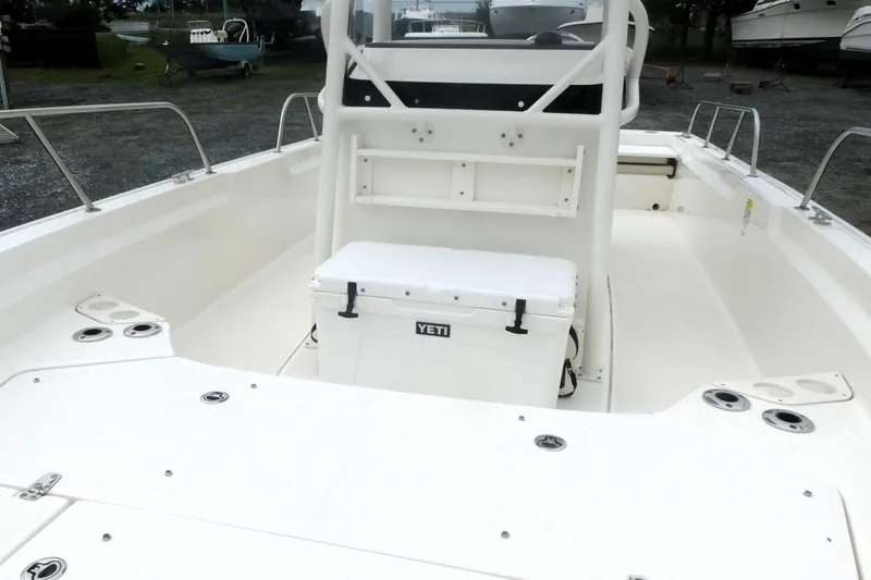 Slide: The Image of 2023 Boston Whaler 210 Montauk boat interior with Yeti cooler and seating. - 10
