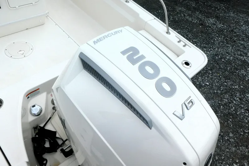 Slide: The Image of 2023 Boston Whaler 210 Montauk with Mercury 200 V6 engine, rear deck view. - 3