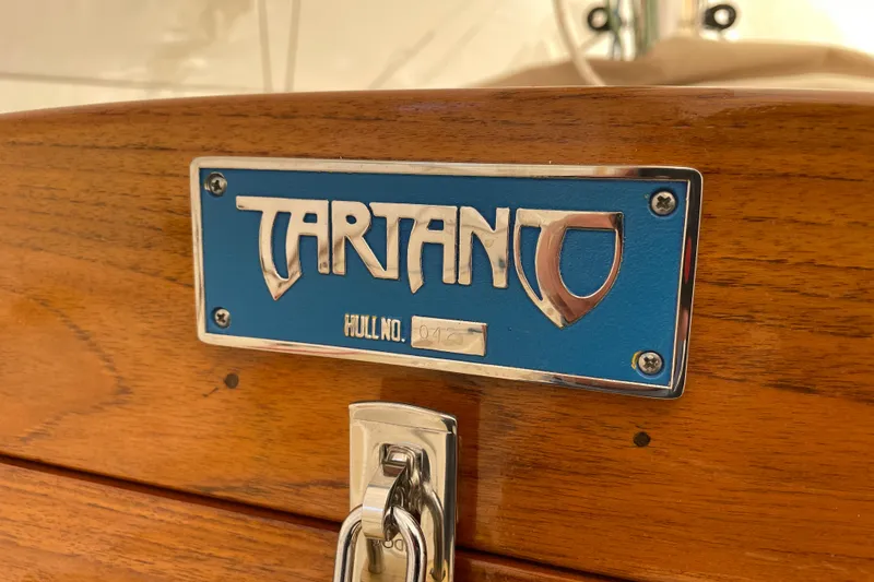 Slide: The Image of 2025 Tartan Fantail nameplate on wooden surface, showcasing hull number detail. - 12