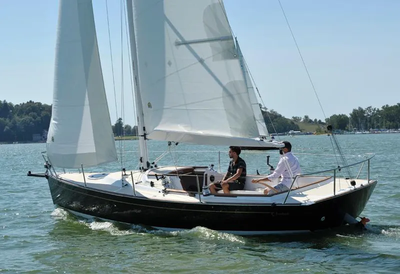 Slide: The Image of Manufacturer Provided Image: 2025 Tartan Fantail sailboat on calm water with two people onboard. - 2