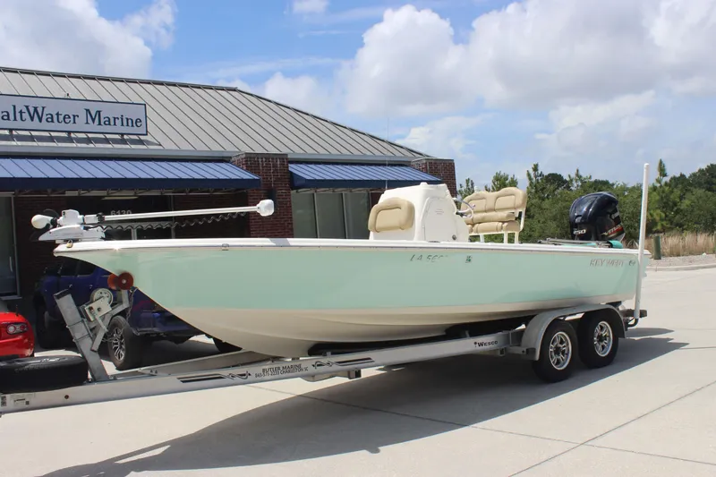 Slide: The Image of 2026 Key West 230 Bay Reef boat on trailer outside SaltWater Marine. - 1