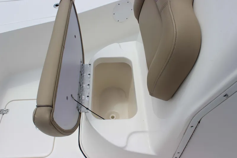 Slide: The Image of 2026 Key West 230 Bay Reef boat seat with storage compartment open. - 17