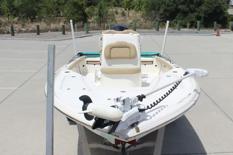 Slide: The Image of 2026 Key West 230 Bay Reef boat parked on concrete surface, front view. - 2