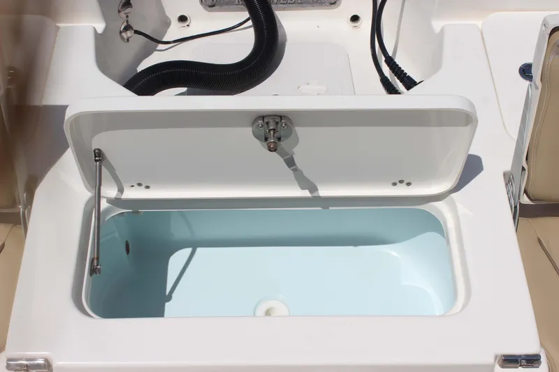 Slide: The Image of Livewell compartment on a 2026 Key West 230 Bay Reef boat, open and ready for use. - 21