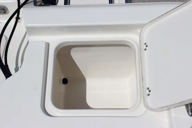 Slide: The Image of Open storage compartment on 2026 Key West 230 Bay Reef boat. - 22