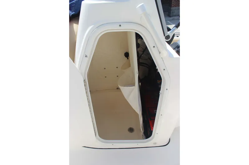 Slide: The Image of 2026 Key West 230 Bay Reef boat storage compartment interior view. - 5