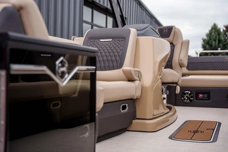 Slide: The Image of Luxurious interior of 2026 Harris Sunliner 230 pontoon boat with plush seating and modern design. - 21