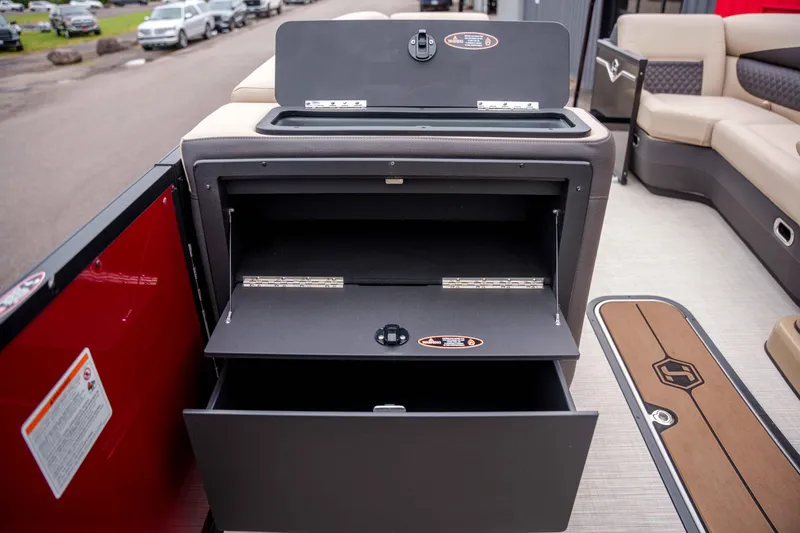 Slide: The Image of 2026 Harris Sunliner 230 boat interior with open storage compartments. - 29