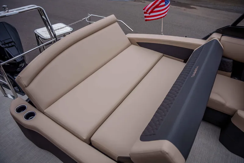 Slide: The Image of Luxurious seating on 2026 Harris Sunliner 230 pontoon boat with American flag. - 35