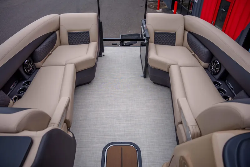 Slide: The Image of Luxurious interior of 2026 Harris Sunliner 230 pontoon boat with beige seating. - 36