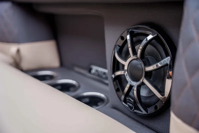 Slide: The Image of Speaker and cup holders in 2026 Harris Sunliner 230 boat interior. - 38