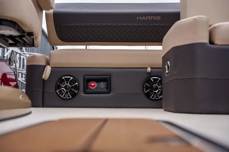Slide: The Image of Interior of 2026 Harris Sunliner 230 boat featuring speakers and luxurious seating. - 39