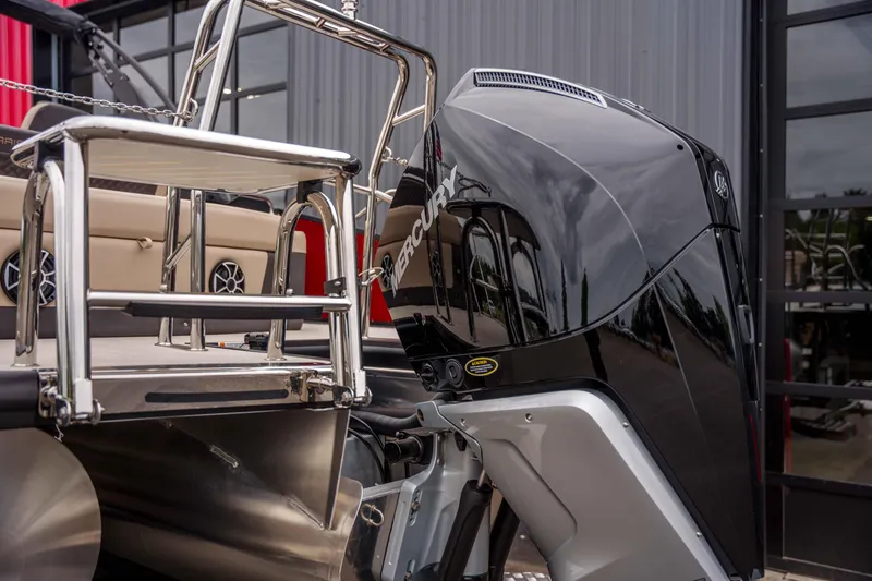 Slide: The Image of 2026 Harris Sunliner 230 boat with Mercury outboard motor and stainless steel ladder. - 45
