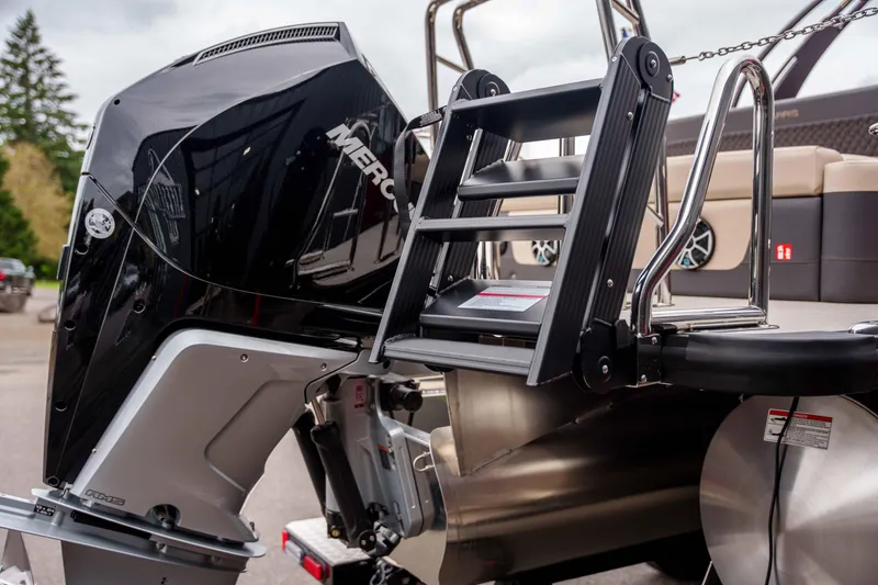 Slide: The Image of 2026 Harris Sunliner 230 boat with Mercury outboard motor and swim ladder. - 46