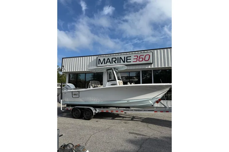 The Image of 2026 Sea Hunt Ultra 255 SE boat on trailer at Marine 360 dealership. - 0
