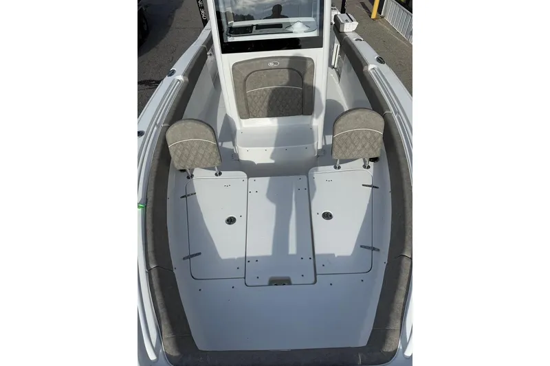 Slide: The Image of 2026 Sea Hunt Ultra 255 SE boat interior with seating and storage compartments. - 15