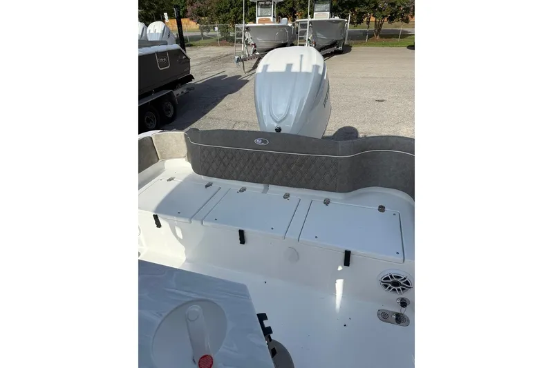 Slide: The Image of 2026 Sea Hunt Ultra 255 SE boat interior with storage compartments and seating. - 21