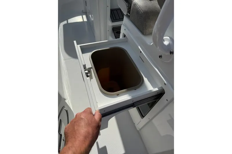 Slide: The Image of Pull-out storage compartment on 2026 Sea Hunt Ultra 255 SE boat. - 23