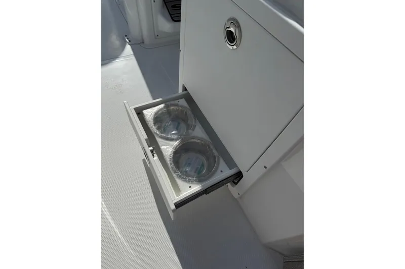 Slide: The Image of Drawer with two sealed bowls on a 2026 Sea Hunt Ultra 255 SE boat. - 24