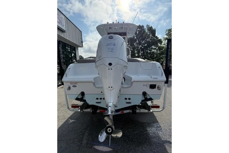 Slide: The Image of 2026 Sea Hunt Ultra 255 SE boat rear view with powerful outboard motor. - 3