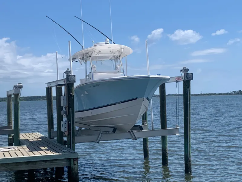 The Image of Regulator FS 2015 boat on lift by the water. - 0