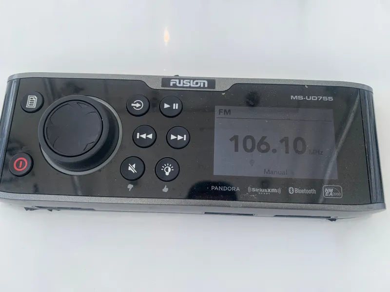 Slide: The Image of Fusion MS-UD755 radio displaying FM 106.10 MHz. - 13