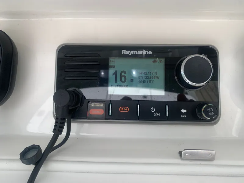 Slide: The Image of Raymarine device on 2015 Regulator FS boat, displaying coordinates and time. - 19