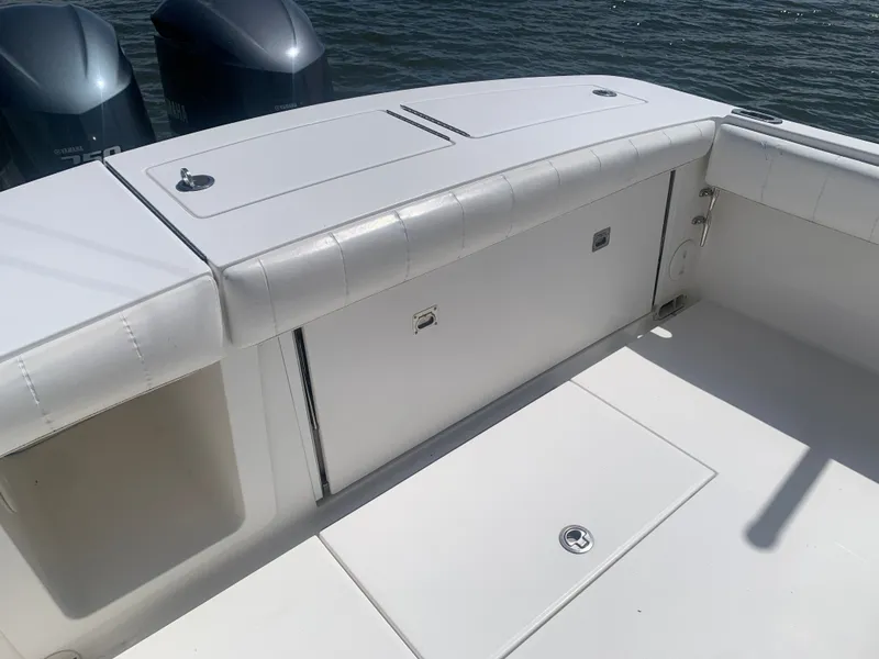 Slide: The Image of 2015 Regulator FS boat with Yamaha engines by the water. - 21