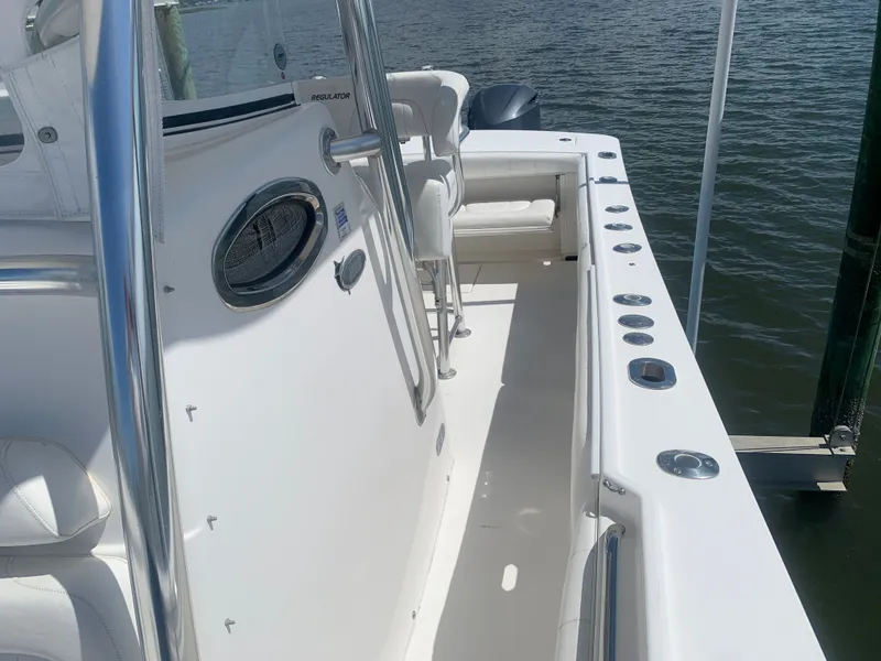 Slide: The Image of Regulator FS 2015 boat with white deck and seating area. - 30