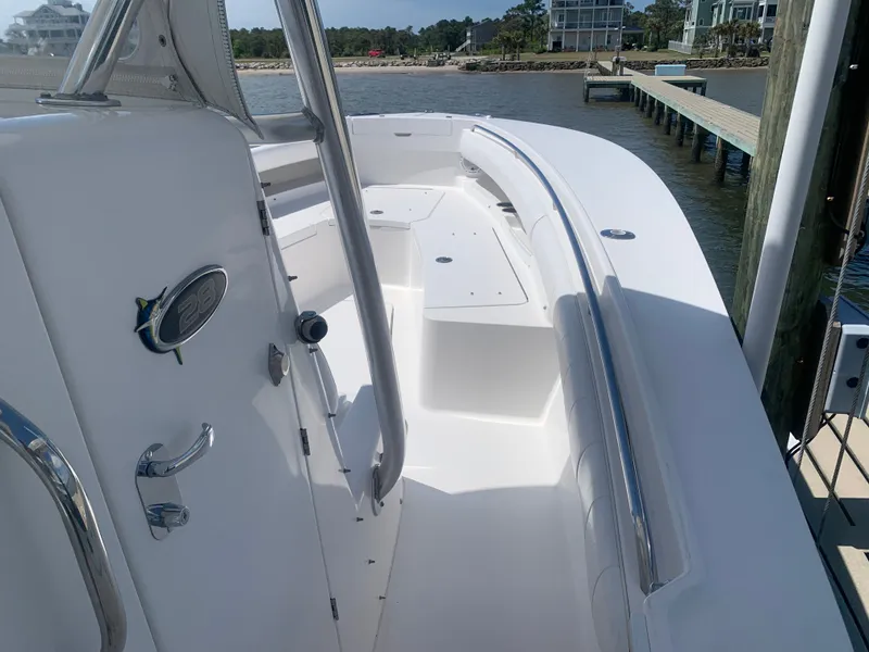 Slide: The Image of Regulator FS 2015 boat docked with white deck and railing. - 31