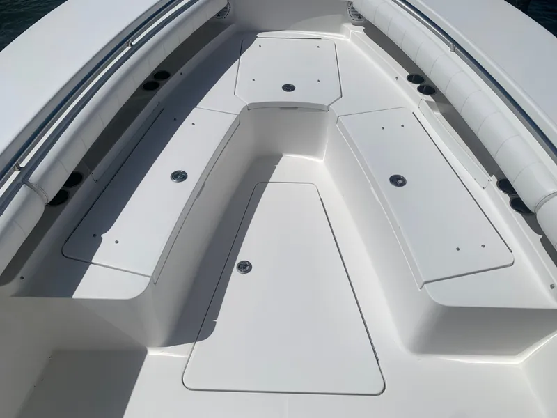 Slide: The Image of 2015 Regulator FS boat, spacious deck with storage compartments. - 35