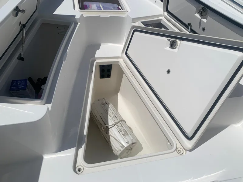 Slide: The Image of 2015 Regulator FS boat with open storage compartments. - 39