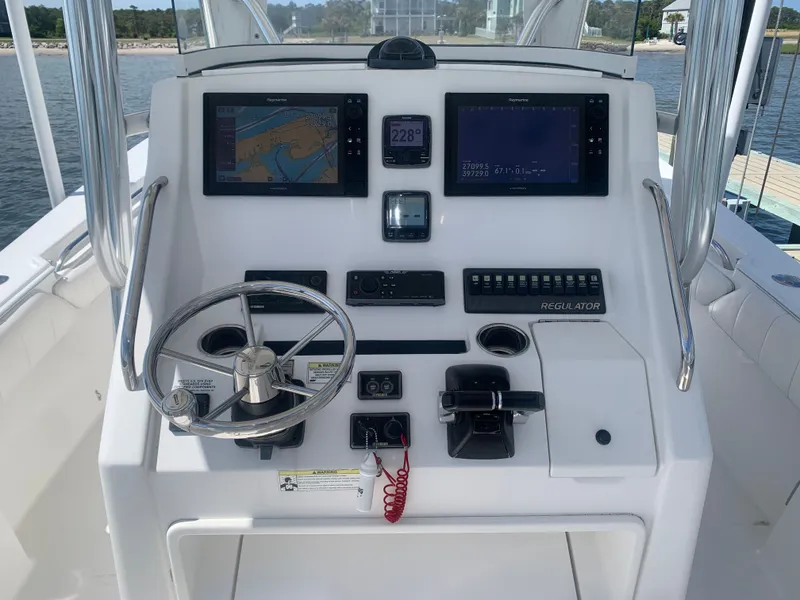 Slide: The Image of Control console of a 2015 Regulator FS boat. - 6
