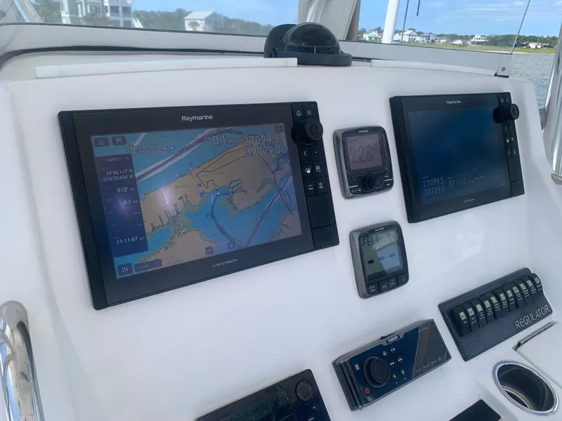 Slide: The Image of Regulator FS 2015 boat console with navigation systems and controls. - 9