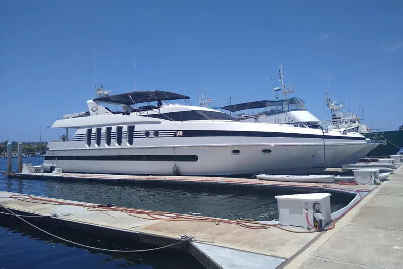 The Image of Luxury Monte Fino 92 yacht from 1996 docked at marina under clear blue sky. - 0