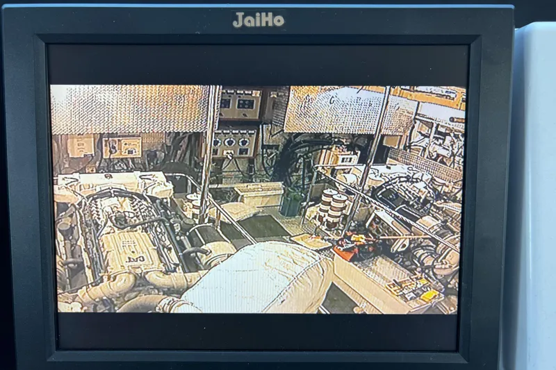 Slide: The Image of Engine room of a 1996 Monte Fino 92 yacht, featuring complex machinery and control panels. - 34