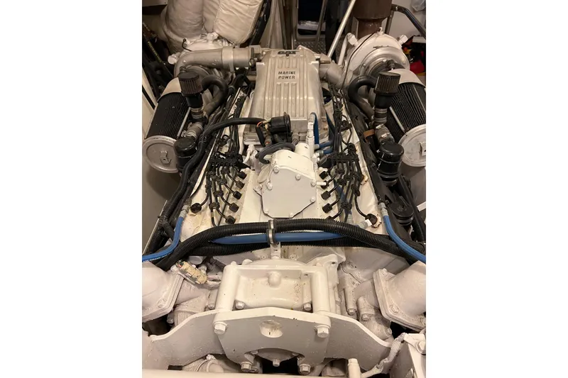 Slide: The Image of Engine of a 1996 Monte Fino 92 yacht, showcasing detailed mechanical components. - 48