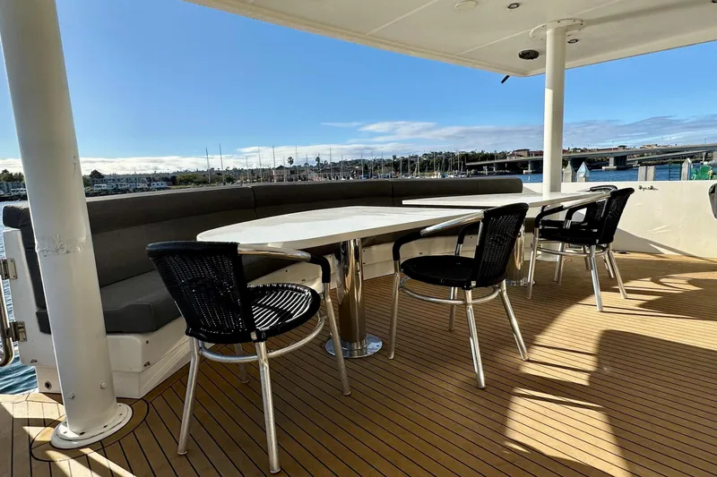 Slide: The Image of Outdoor seating area on a 1996 Monte Fino 92 yacht with ocean view. - 50