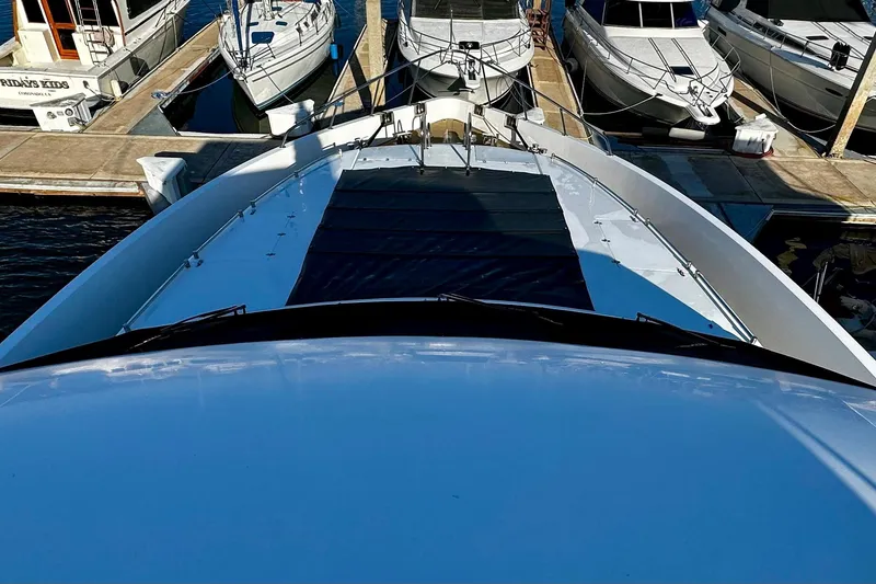 Slide: The Image of Bow view of 1996 Monte Fino 92 yacht docked at marina. - 53
