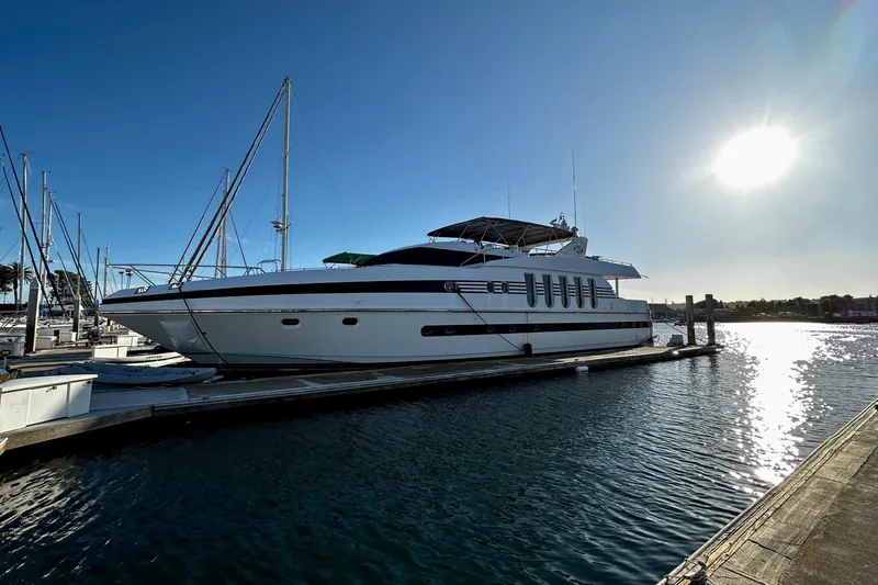 Slide: The Image of Monte Fino 92 yacht from 1996 docked at marina under clear sky. - 6