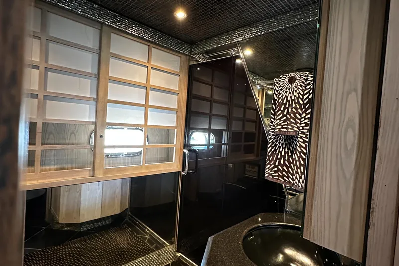 Slide: The Image of Luxurious Monte Fino 92 yacht interior with elegant wood paneling and modern design, 1996 model. - 66