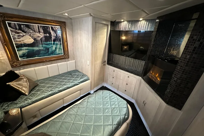 Slide: The Image of Luxurious Monte Fino 92 yacht cabin, 1996 model, featuring elegant decor and modern amenities. - 68