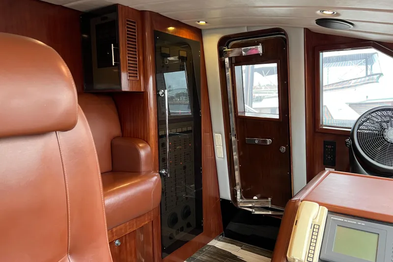 Slide: The Image of Luxurious Monte Fino 92 yacht interior with leather seating and control panel, 1996 model. - 80