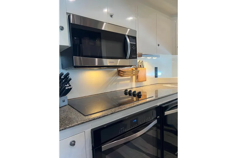 Slide: The Image of Modern kitchen with stainless steel appliances on a Monte Fino 92 yacht, 1996 model. - 86