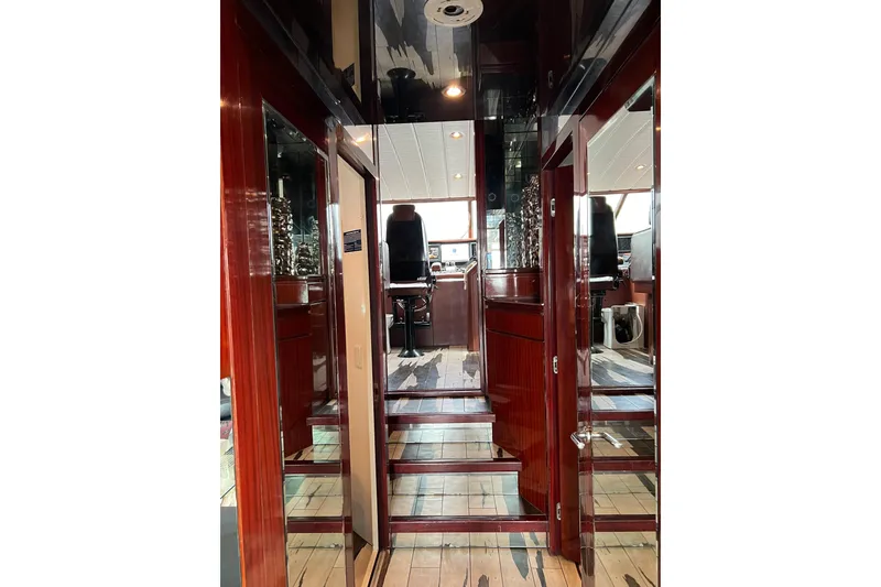 Slide: The Image of Interior of 1996 Monte Fino 92 yacht with polished wood and modern helm. - 88