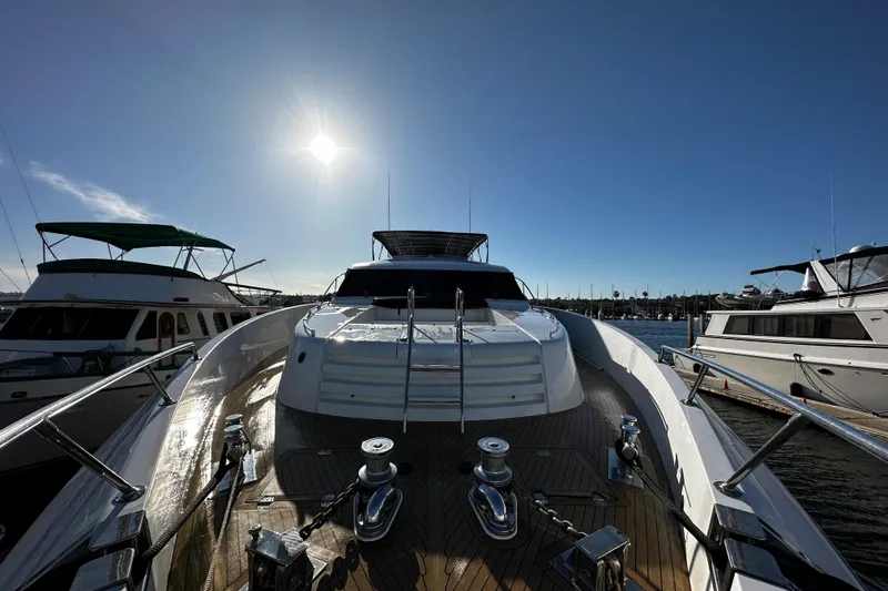 Slide: The Image of Monte Fino 92 yacht from 1996 docked under a clear blue sky. - 9
